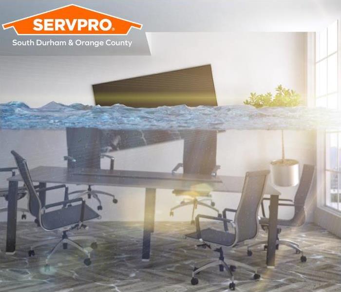 Office environment flooded, chairs and desk are under water